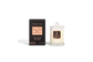 Body Safe, Organic Massage Candle in Opulent Glow fragrance which  is  Black Musk and Pear scent , Rose Gold Highlights on a black box next to the glass massage candle.